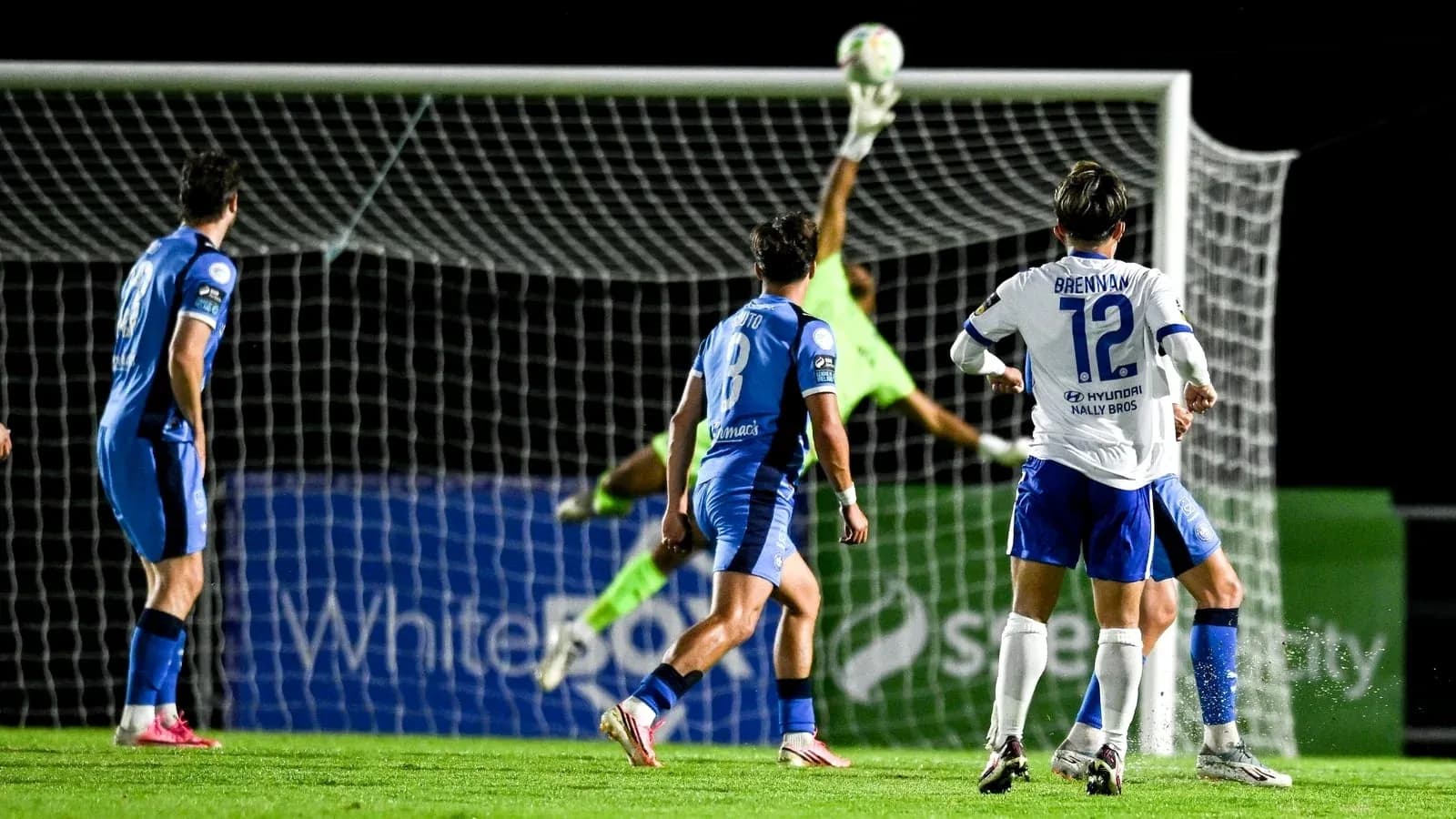 Goalkeeper making a save during soccer match