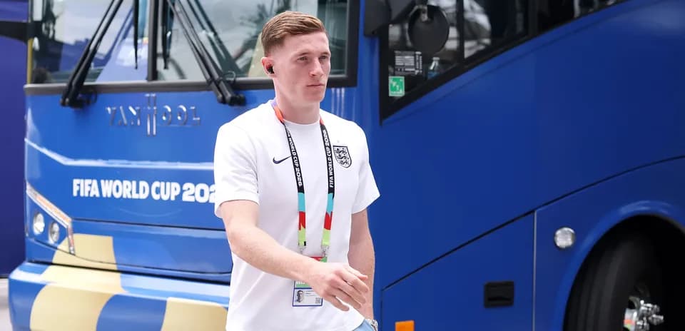 Player walking near team bus before match