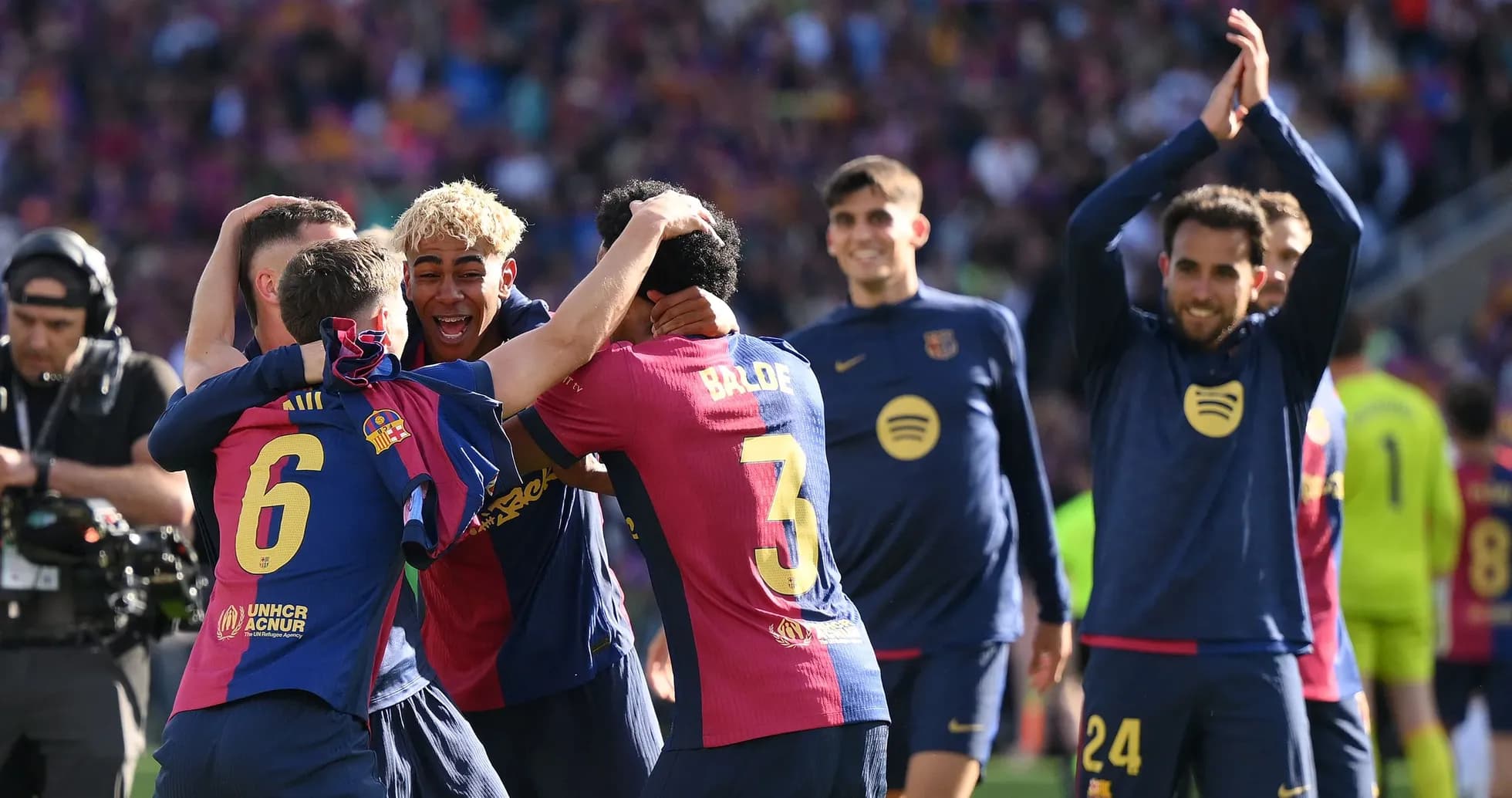 Barcelona players celebrating a victory on the pitch