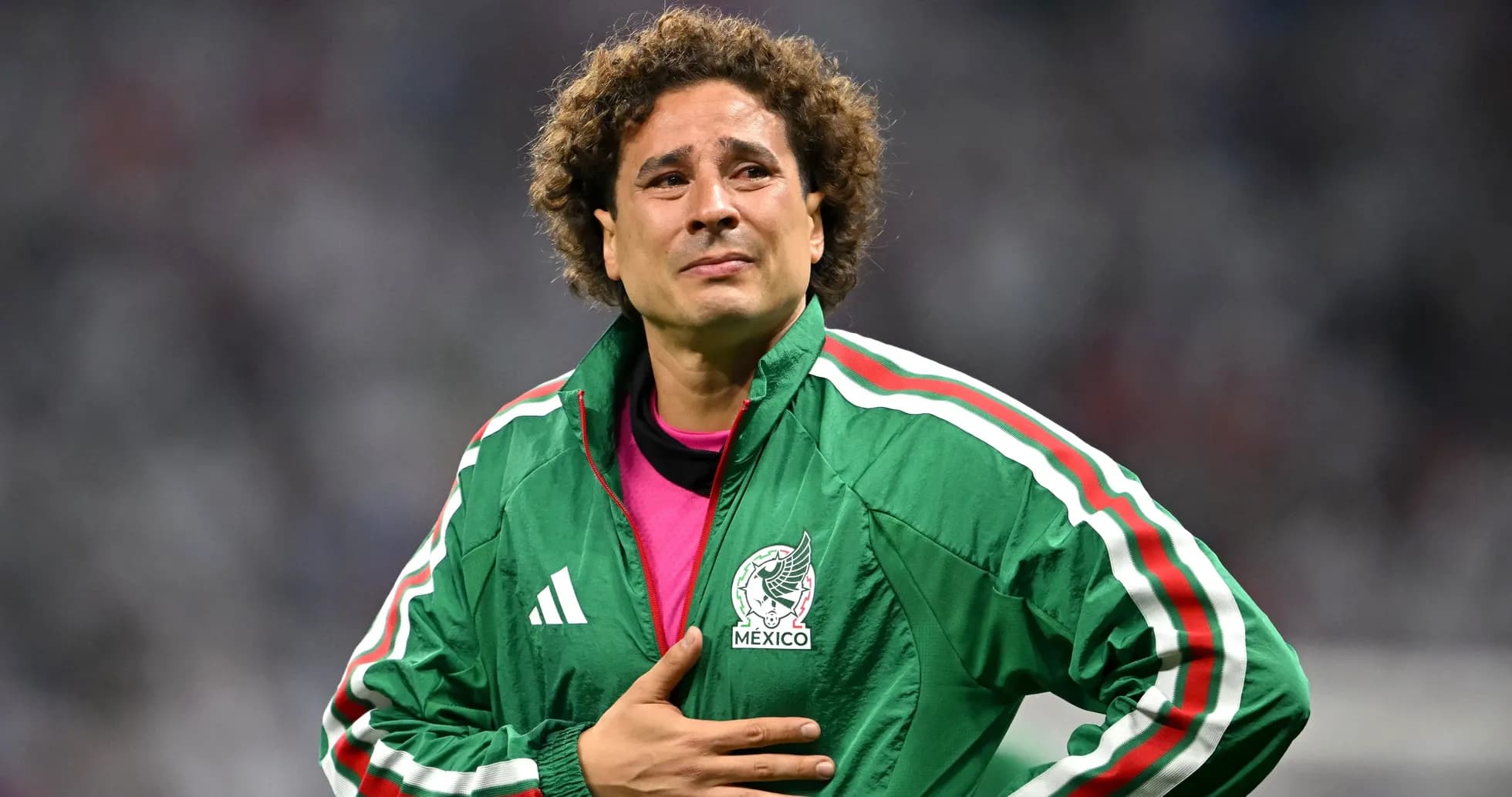 Goalkeeper wearing Mexico jacket on the field