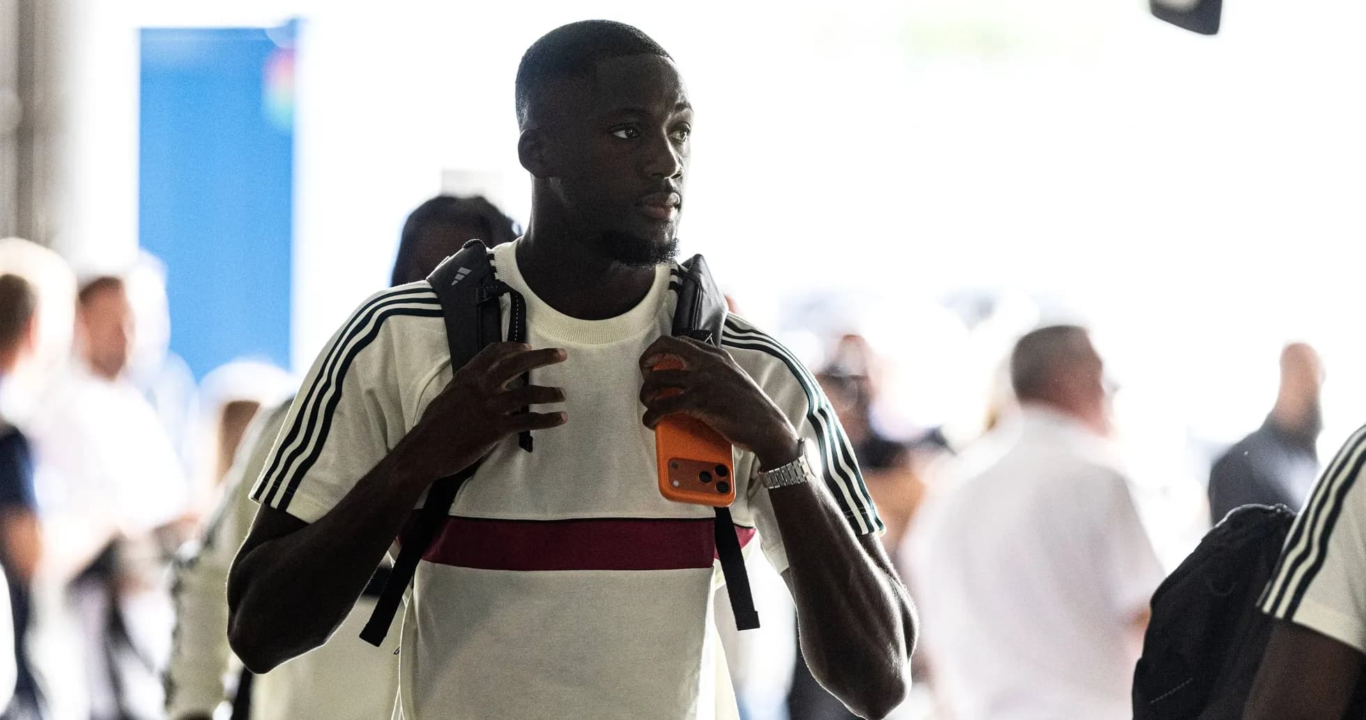 Player walking through tunnel with backpack and phone