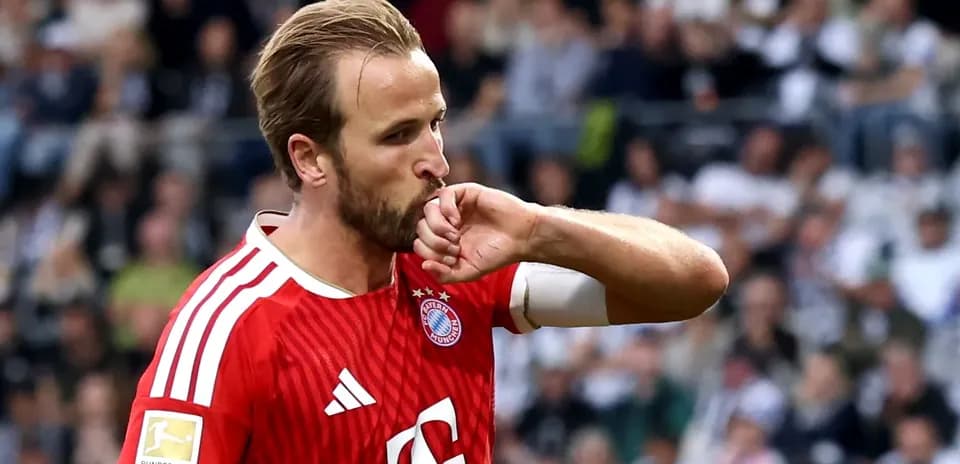 Player celebrating with hand kiss during match