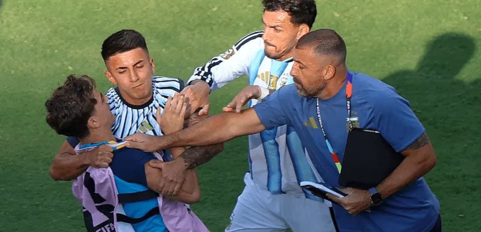 Players and staff involved in a confrontation on field