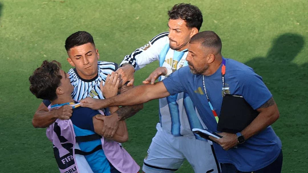 Players and staff involved in a confrontation on field