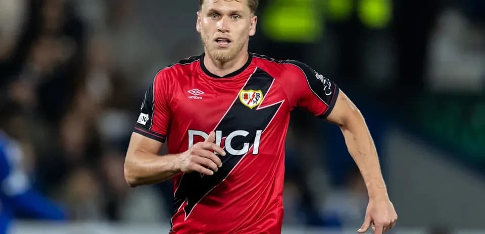 Player in red jersey running on the field