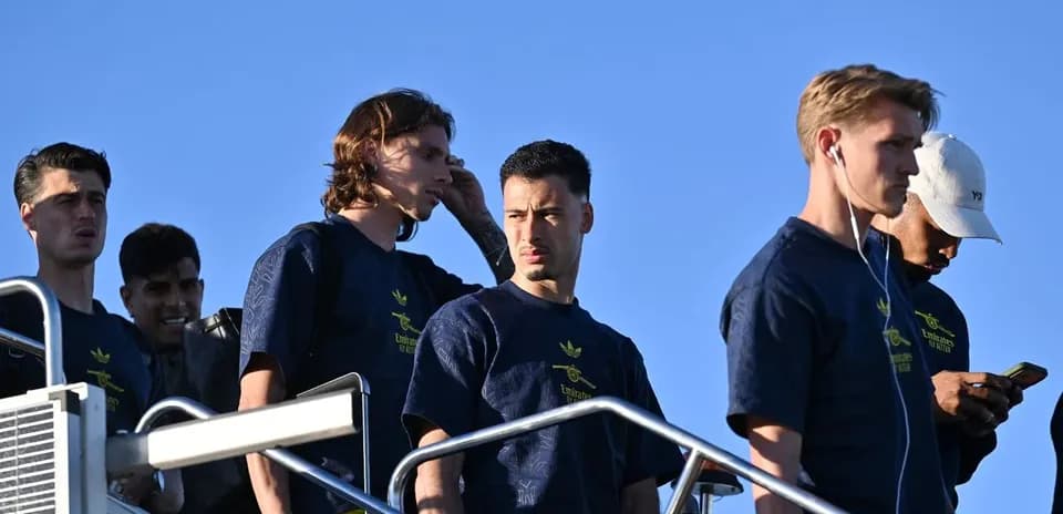 Players descending stairs in team apparel outdoors