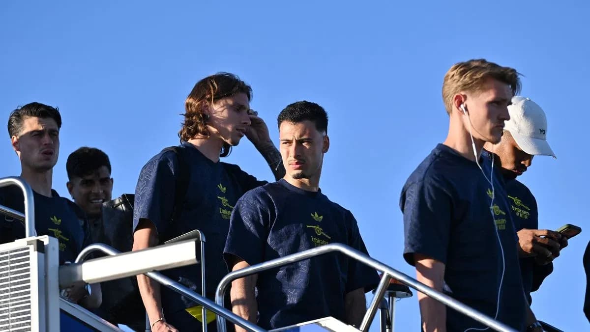 Players descending stairs in team apparel outdoors