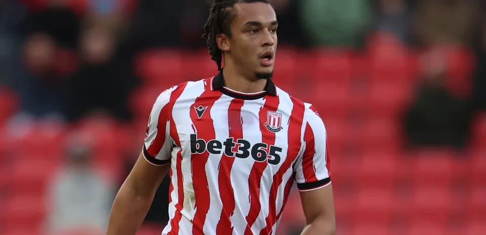 Stoke City player in red and white striped jersey