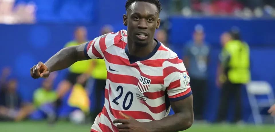 Player wearing USA jersey celebrating on the field