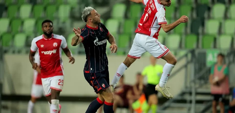 Player heading the ball during FK Crvena Zvezda match