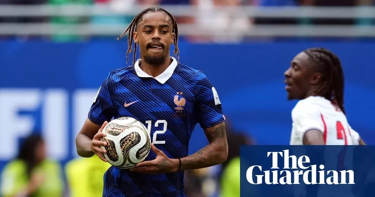Player in France kit holding soccer ball during match