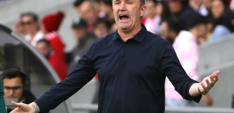 Coach gesturing during match from the sidelines