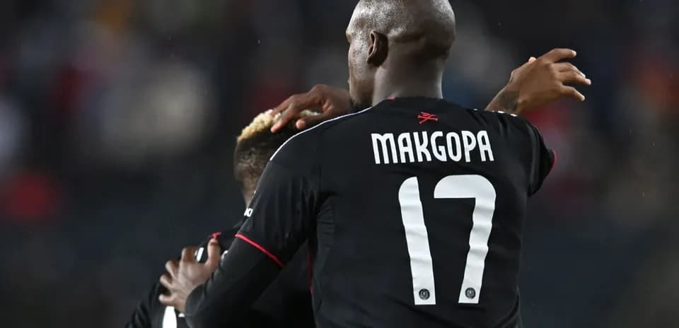 Players celebrating a goal during the match