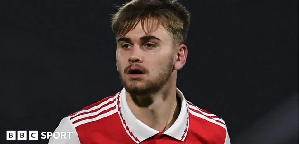 Player in red jersey during football match