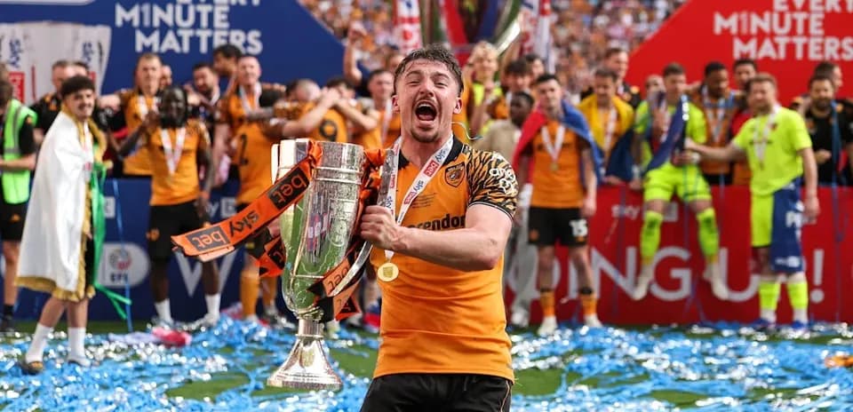 Player celebrating with trophy during victory ceremony