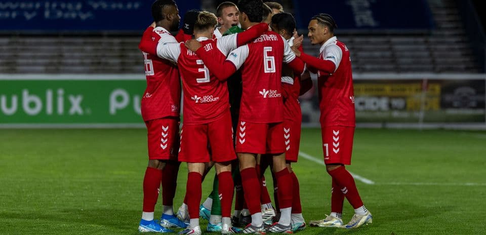 Players celebrating during Loudoun United match