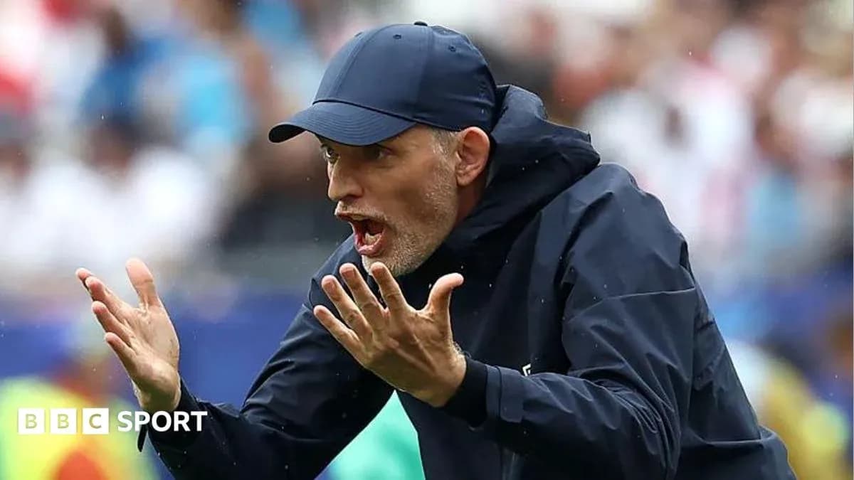 Coach gesturing during a match from the sidelines