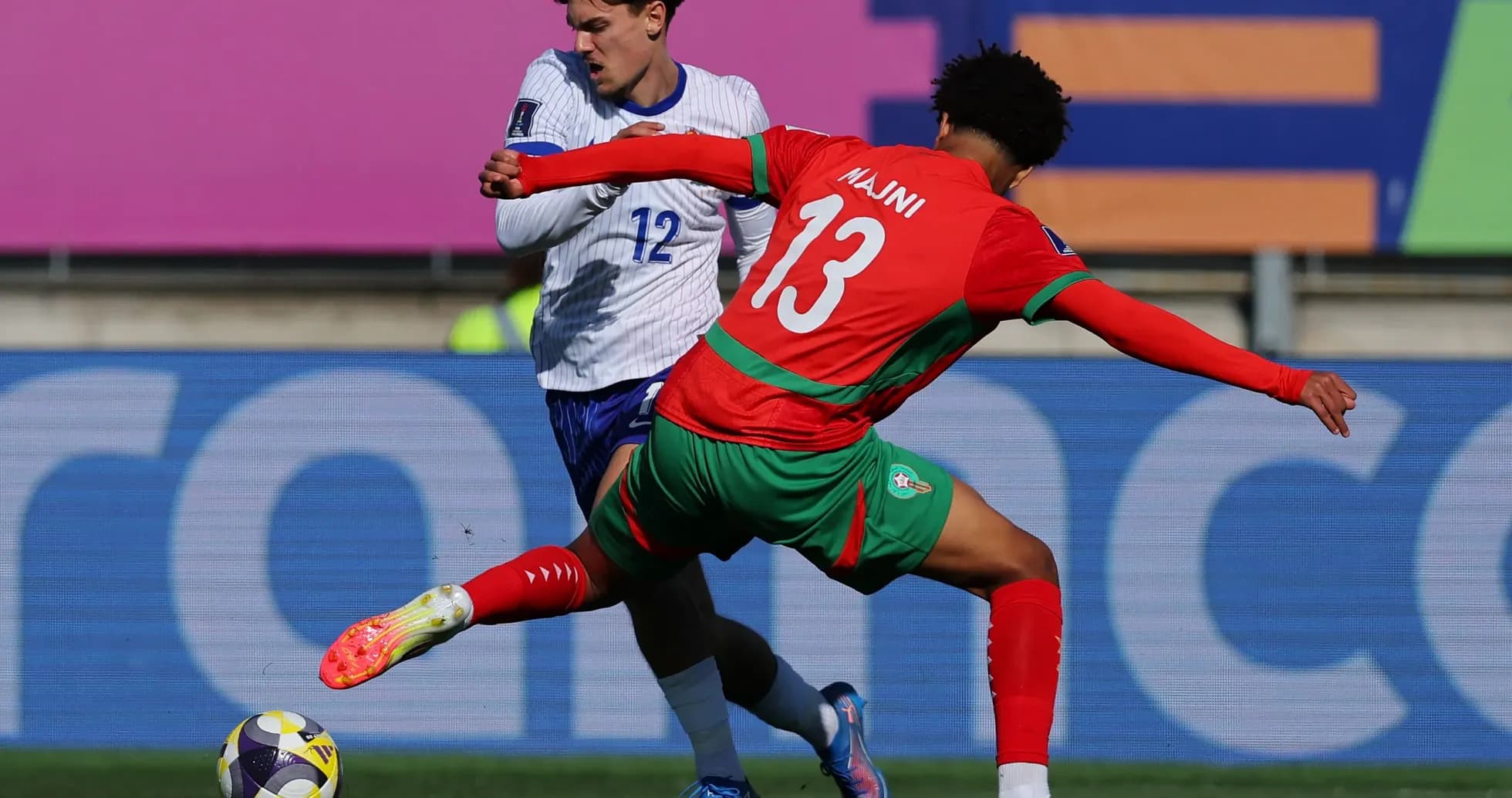 Player tackling opponent during football match action