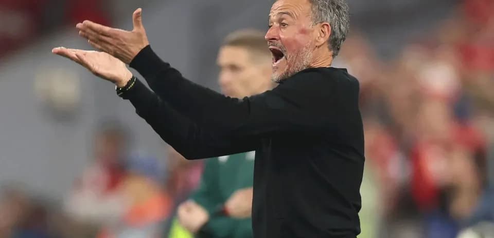 Coach gesturing during a football match