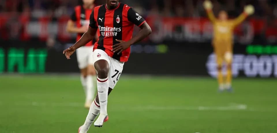AC Milan player running with the ball during match