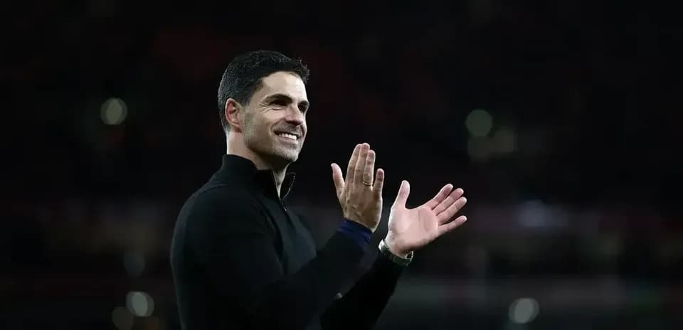 Manager applauding during post-match celebration