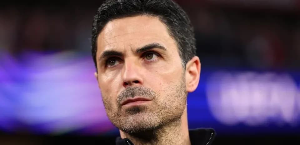 Coach observing during a match at the stadium