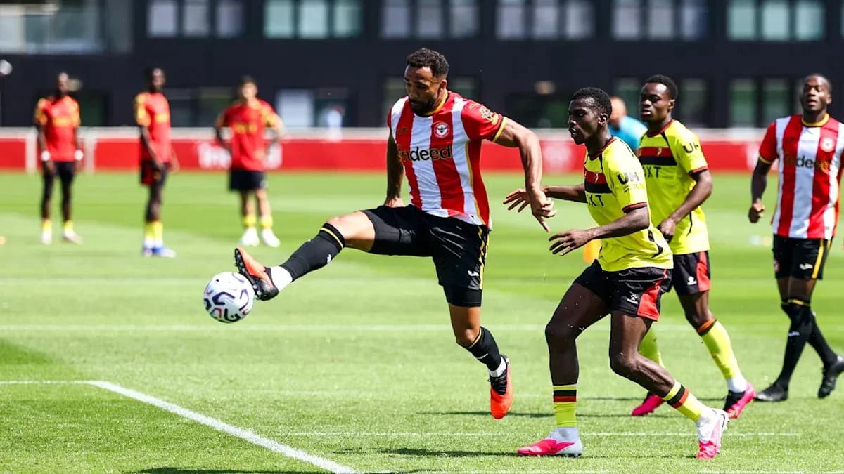 Player kicking ball during training session on pitch