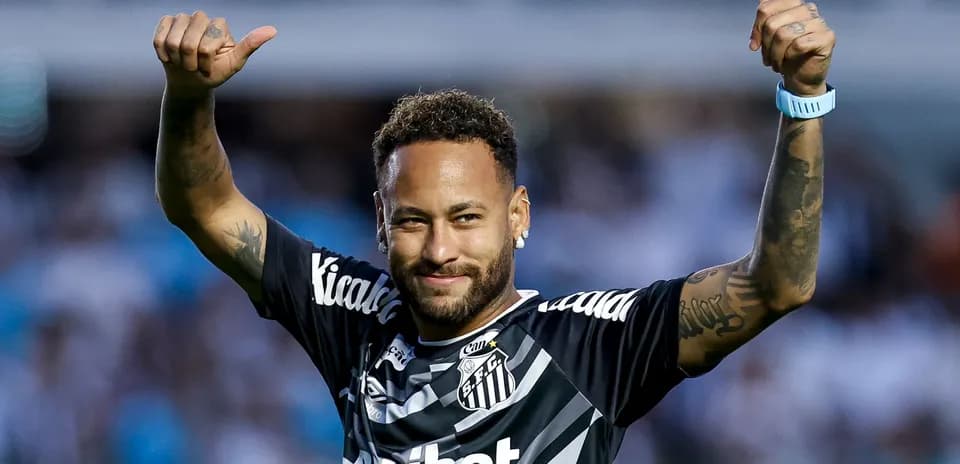 Neymar celebrating with thumbs up in Santos jersey