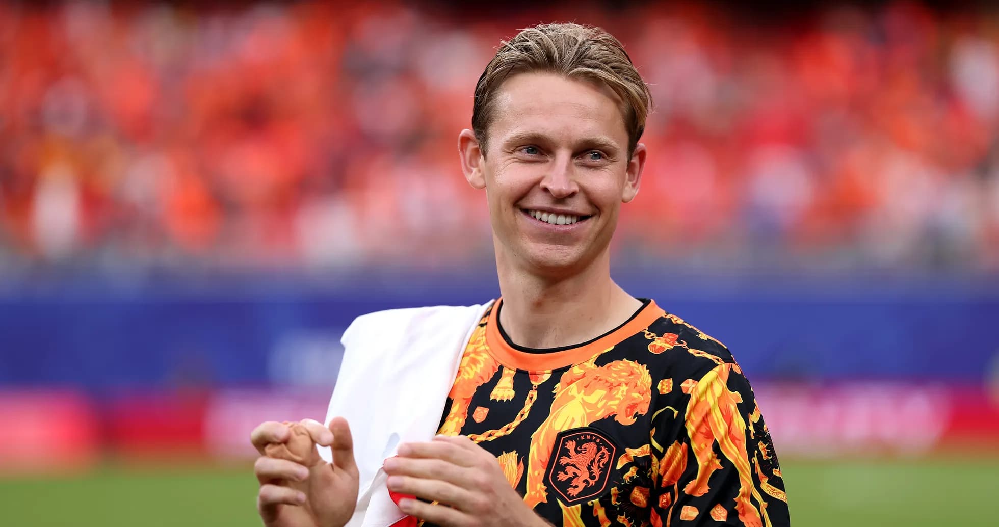 Player wearing vibrant shirt on football pitch