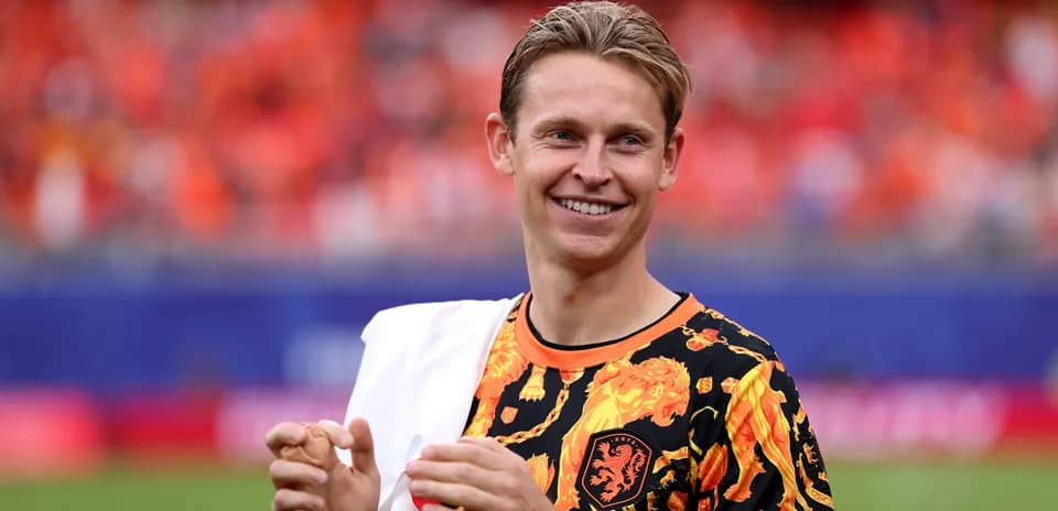 Player wearing vibrant shirt on football pitch