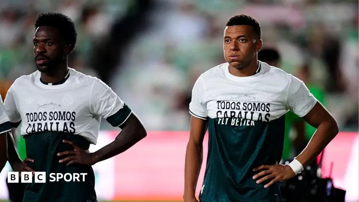 Two players wearing matching shirts on the field