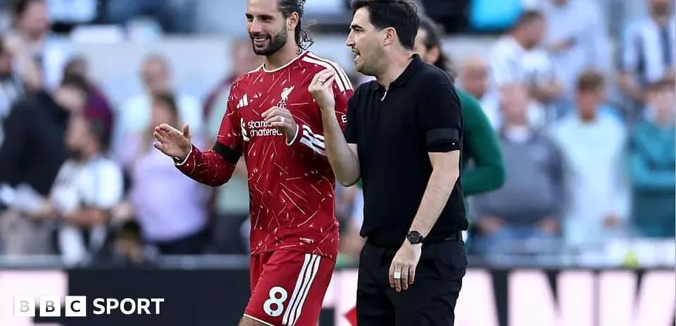 Player and coach discussing on the sideline