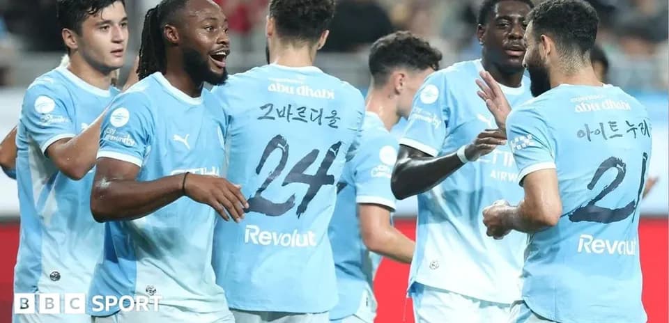 Players celebrating a goal on the pitch