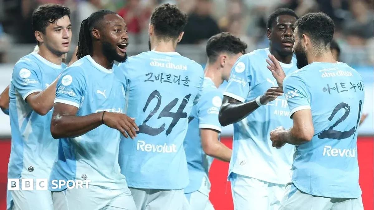 Players celebrating a goal on the pitch