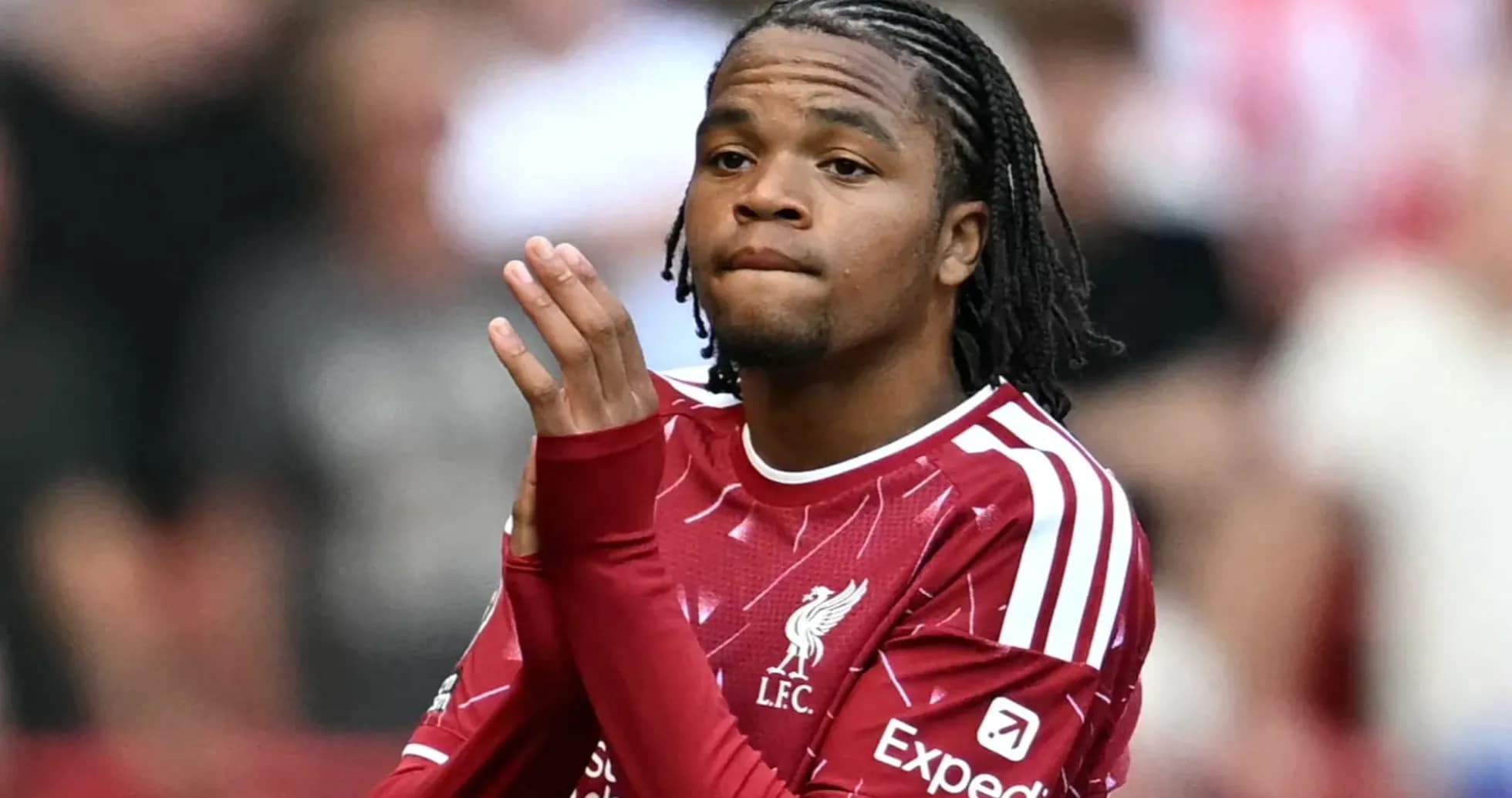 Player applauding fans during match at stadium