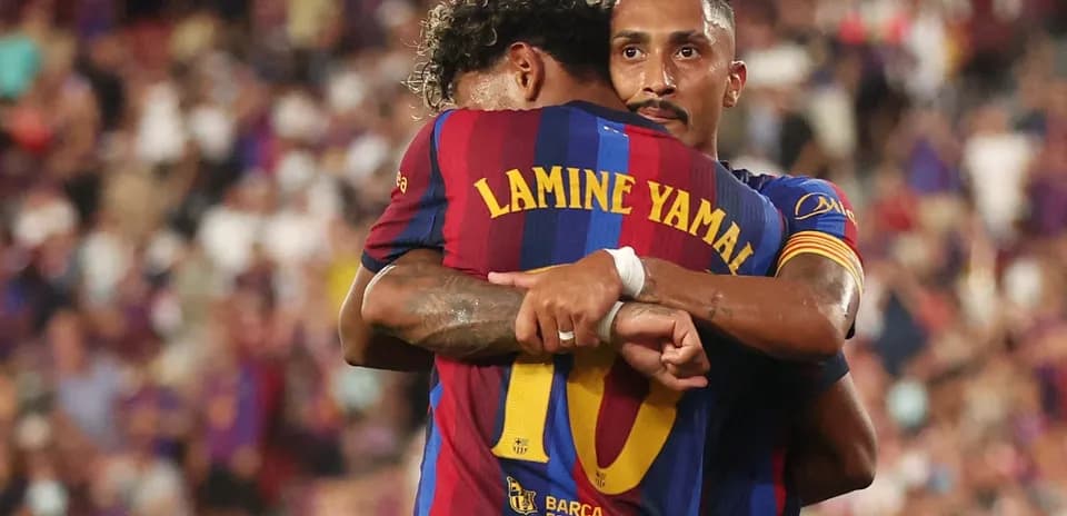 Barcelona players embracing during a match celebration