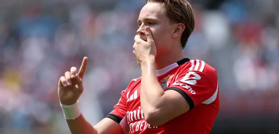 Player celebrating goal with finger raised