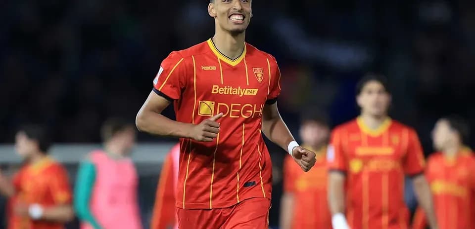 Player celebrating in red jersey during match