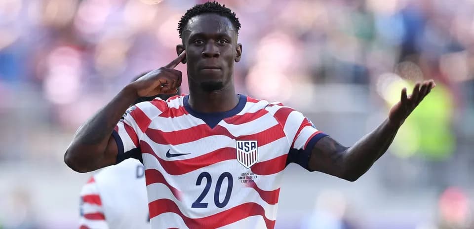 Player celebrating after scoring for USA