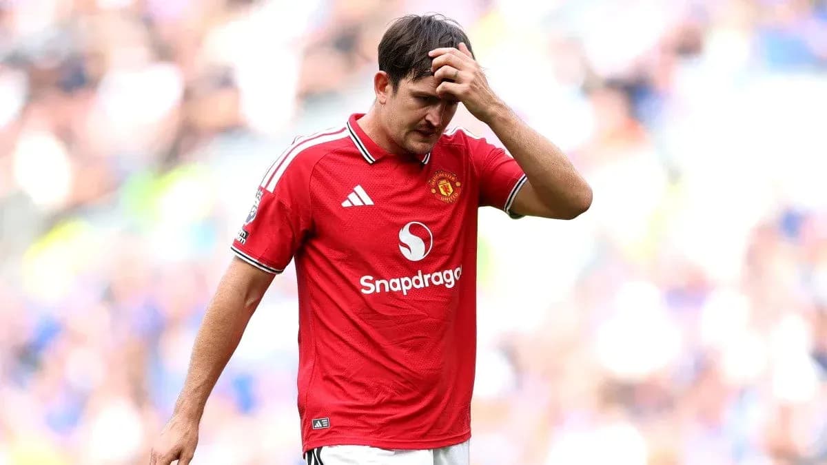 Player in Manchester United jersey walking off field