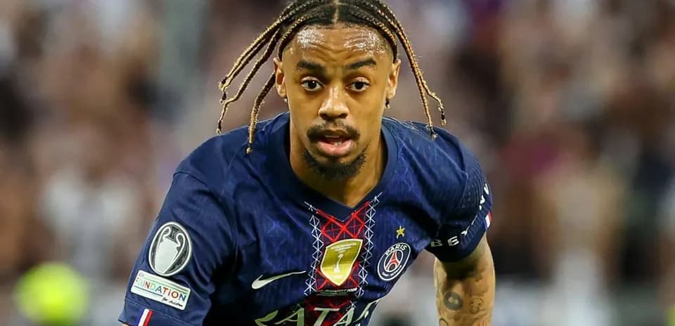 Player in PSG kit running during match action