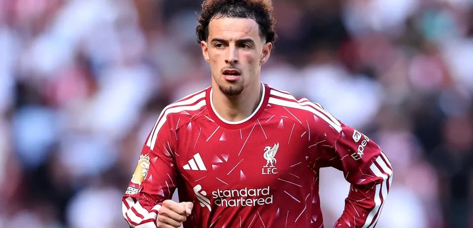 Player in Liverpool kit during match action