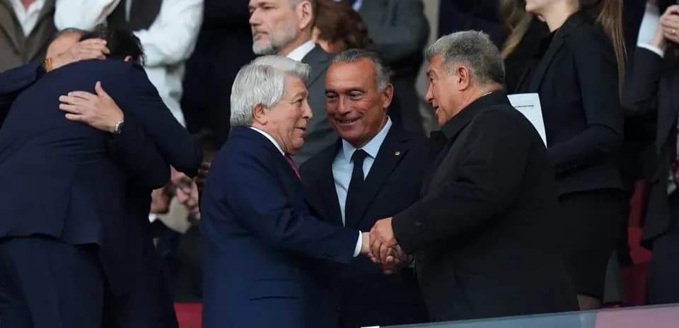 Officials shaking hands in stadium stands