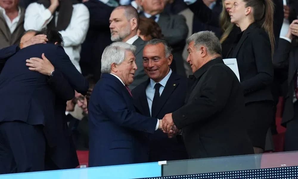 Officials shaking hands in stadium stands