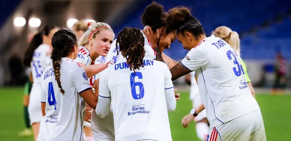 Lyon W celebrating a goal in UEFA Champions League