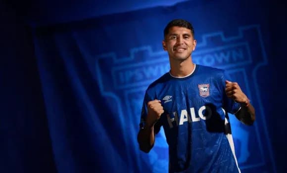 Player posing in Ipswich Town jersey