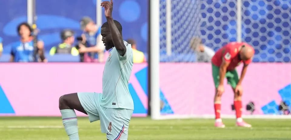 Player kneeling on field during football match