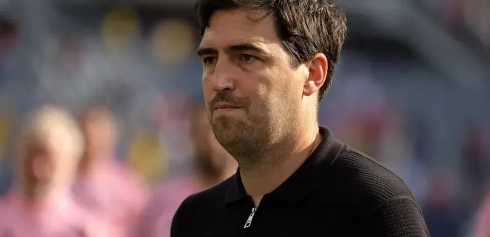 Coach observing the field during warm-up session