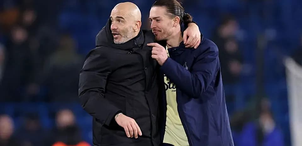 Coach and player embracing after match celebration