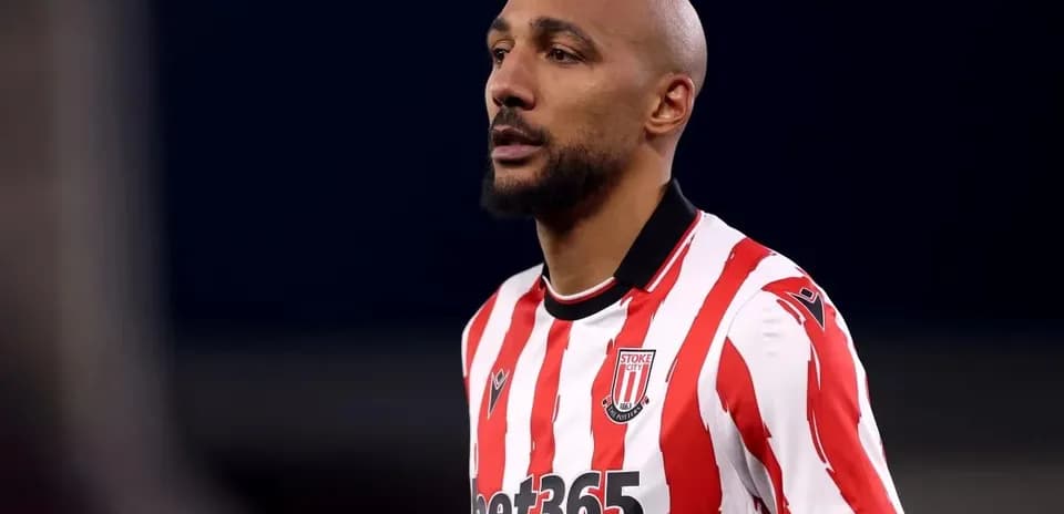 Player wearing Stoke City jersey on the field